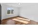 Bright bedroom with hardwood floors, large window, and natural light at 13453 Portside Ln, Lancaster, SC 29720