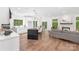 Spacious open-concept kitchen with a large island, stainless steel appliances, and seamless flow into living area at 13453 Portside Ln, Lancaster, SC 29720