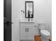 This powder room includes a sleek vanity with a framed mirror and modern fixtures at 13453 Portside Ln, Lancaster, SC 29720