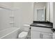 Clean bathroom featuring a shower-tub combo, with vanity, and modern fixtures at 13748 Roderick Dr # 174, Huntersville, NC 28078