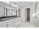 Well-lit bathroom boasting double vanity sinks and a glass walk-in shower at 13748 Roderick Dr # 174, Huntersville, NC 28078