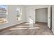 Bright bedroom with vinyl plank flooring, white trim and walls, and natural light at 13748 Roderick Dr # 174, Huntersville, NC 28078