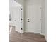 Bright hallway with stylish doors, black hardware, and wood-look flooring at 13748 Roderick Dr # 174, Huntersville, NC 28078
