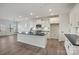 Kitchen features a center island with dark countertop, white cabinets and stainless steel appliances at 13748 Roderick Dr # 174, Huntersville, NC 28078
