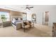 This bedroom boasts a tray ceiling, a neutral color scheme, and natural light at 13748 Roderick Dr # 174, Huntersville, NC 28078