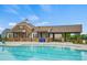 Community pool featuring a well-appointed clubhouse and inviting lounge area at 13748 Roderick Dr # 174, Huntersville, NC 28078