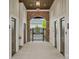Community pool access through brick archway with decorative iron gate and mens/womens restrooms at 13748 Roderick Dr # 174, Huntersville, NC 28078