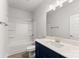 Clean bathroom featuring a shower and bathtub combo, single sink vanity with a dark wood cabinet and a large mirror at 1469 Mocksville Hwy # 21, Statesville, NC 28625