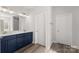 Stylish bathroom with double vanity, a large mirror and modern fixtures at 1469 Mocksville Hwy # 21, Statesville, NC 28625