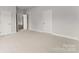 Spacious bedroom featuring neutral carpet, crisp white walls, and plenty of closet space at 1469 Mocksville Hwy # 21, Statesville, NC 28625