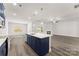 Open kitchen featuring stainless steel appliances and large island, flowing into living area at 1469 Mocksville Hwy # 21, Statesville, NC 28625