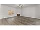 Living room with fireplace, ceiling fan, recessed lights and hardwood floors at 1469 Mocksville Hwy # 21, Statesville, NC 28625