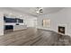 Open concept living area with fireplace, hardwood floors, recessed lights and view of kitchen at 1469 Mocksville Hwy # 21, Statesville, NC 28625