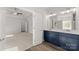 Stylish bathroom with double vanity, a large mirror and modern fixtures at 1469 Mocksville Hwy # 21, Statesville, NC 28625
