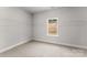 Walk-in closet with built-in shelving and a window provides ample storage space and natural light at 1469 Mocksville Hwy # 21, Statesville, NC 28625