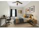 Comfortable bedroom with natural light, desk, and carpet flooring, ideal for relaxation or focused study at 15024 Old Vermillion Dr, Huntersville, NC 28078