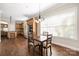 Cozy breakfast area with hardwood floors, a chandelier, and stainless steel appliances at 15024 Old Vermillion Dr, Huntersville, NC 28078
