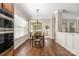 Bright breakfast area featuring hardwood floors, a chandelier, and a view of the backyard at 15024 Old Vermillion Dr, Huntersville, NC 28078