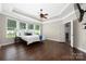 Comfortable main bedroom with hardwood floors and large windows at 15024 Old Vermillion Dr, Huntersville, NC 28078