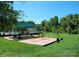 Community playground with swings, slide, and play area for outdoor fun at 15024 Old Vermillion Dr, Huntersville, NC 28078