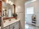 Charming bathroom featuring rustic wood accents, a sleek vanity, and an inviting atmosphere at 15323 Barnsbury Dr, Huntersville, NC 28078