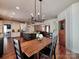 Dining area connects to kitchen, offering a view into other living spaces at 15323 Barnsbury Dr, Huntersville, NC 28078