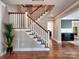 Elegant foyer with hardwood floors, staircase, and access to multiple rooms at 15323 Barnsbury Dr, Huntersville, NC 28078