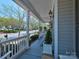 Cozy front porch with ample seating and scenic neighborhood views at 15323 Barnsbury Dr, Huntersville, NC 28078