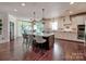 Spacious kitchen with a large island that connects the living and dining rooms at 15323 Barnsbury Dr, Huntersville, NC 28078