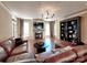 Bright living room includes a fireplace, custom shelving, and lots of space at 15323 Barnsbury Dr, Huntersville, NC 28078