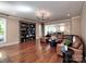 Elegant living room with hardwood floors, built-in shelving, and a comfortable sectional sofa at 15323 Barnsbury Dr, Huntersville, NC 28078