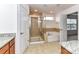 Spacious bathroom with a glass-enclosed shower and separate soaking tub at 15747 Reynolds Dr, Indian Land, SC 29707