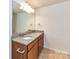 Bathroom featuring double sinks, granite countertops and tan ceramic tile floors at 15747 Reynolds Dr, Indian Land, SC 29707
