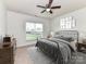 Cozy bedroom with a metal bed frame, soft lighting, and simple decor for a restful and inviting space at 15747 Reynolds Dr, Indian Land, SC 29707