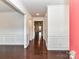 Elegant entryway with gleaming hardwood floors, detailed wainscoting, and a bright, welcoming atmosphere at 15747 Reynolds Dr, Indian Land, SC 29707