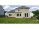 Back exterior of home featuring well-manicured backyard and patio at 15747 Reynolds Dr, Indian Land, SC 29707