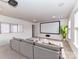 Spacious living room with a large projector screen, and comfortable seating area at 15747 Reynolds Dr, Indian Land, SC 29707
