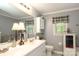 This bathroom features a dual sink vanity and good natural light at 1730 Deer St, Charlotte, NC 28214