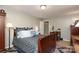Inviting bedroom featuring classic decor, wood furniture, and ample closet space at 1730 Deer St, Charlotte, NC 28214