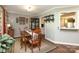 Charming dining room with wooden table and chairs, vintage decor, and natural light at 1730 Deer St, Charlotte, NC 28214