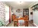 Inviting dining area featuring wooden table, chairs, vintage decor, and window views at 1730 Deer St, Charlotte, NC 28214