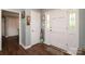 Welcoming foyer with wood-look flooring, paneled doors, and sidelights, creating a bright and inviting space at 1730 Deer St, Charlotte, NC 28214