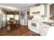 Well-lit kitchen with ample counter space, modern appliances, and eat-in dining area at 1730 Deer St, Charlotte, NC 28214