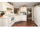 Bright kitchen with white cabinets, modern appliances, and hardwood floors at 1730 Deer St, Charlotte, NC 28214