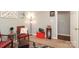 Cozy living room features stylish decor, artwork, and a comfortable seating area, with an open doorway to another room at 1730 Deer St, Charlotte, NC 28214