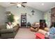 Comfortable living area with high ceilings, cozy furniture, and a brick fireplace as a focal point, great for gatherings at 1730 Deer St, Charlotte, NC 28214