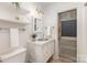 Charming bathroom with vintage-style door, shelves, and unique sink at 1824 Umstead St, Charlotte, NC 28205