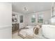 Calm bedroom with large windows, stylish furnishings, and neutral decor at 1824 Umstead St, Charlotte, NC 28205