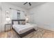 Bright bedroom featuring a cozy bed with stylish pillows and a ceiling fan at 1824 Umstead St, Charlotte, NC 28205