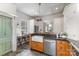Bright kitchen featuring custom wood island, sleek countertops, bar stool seating and stainless steel appliances at 1824 Umstead St, Charlotte, NC 28205